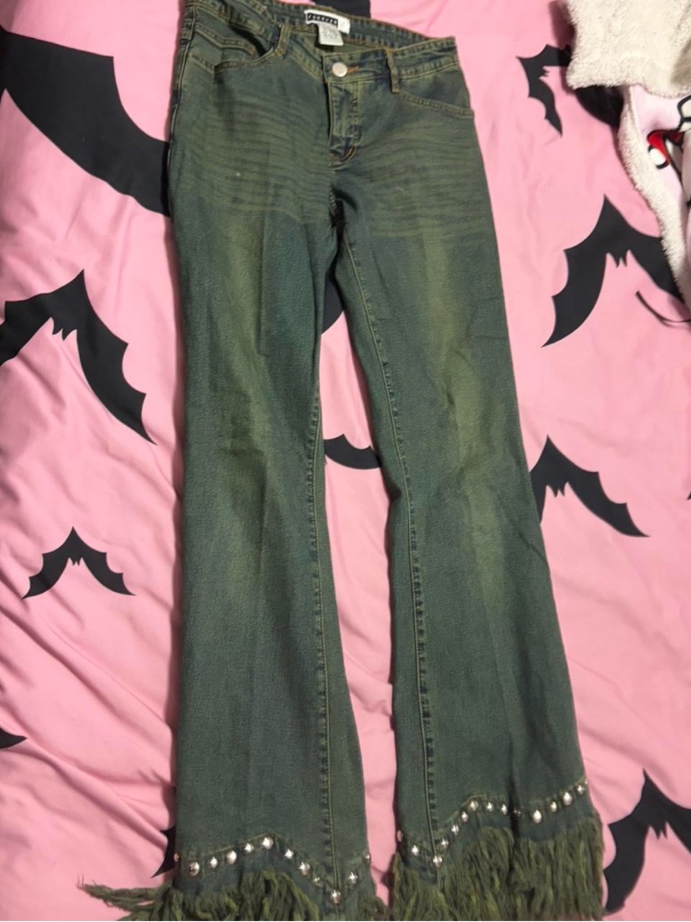 Forever 21 stretchy jeans with distressed hem and studs